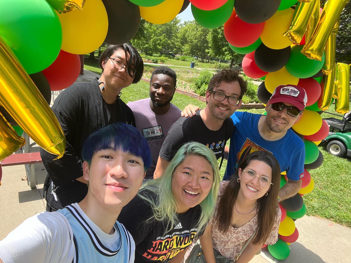 International students under a balloon banner